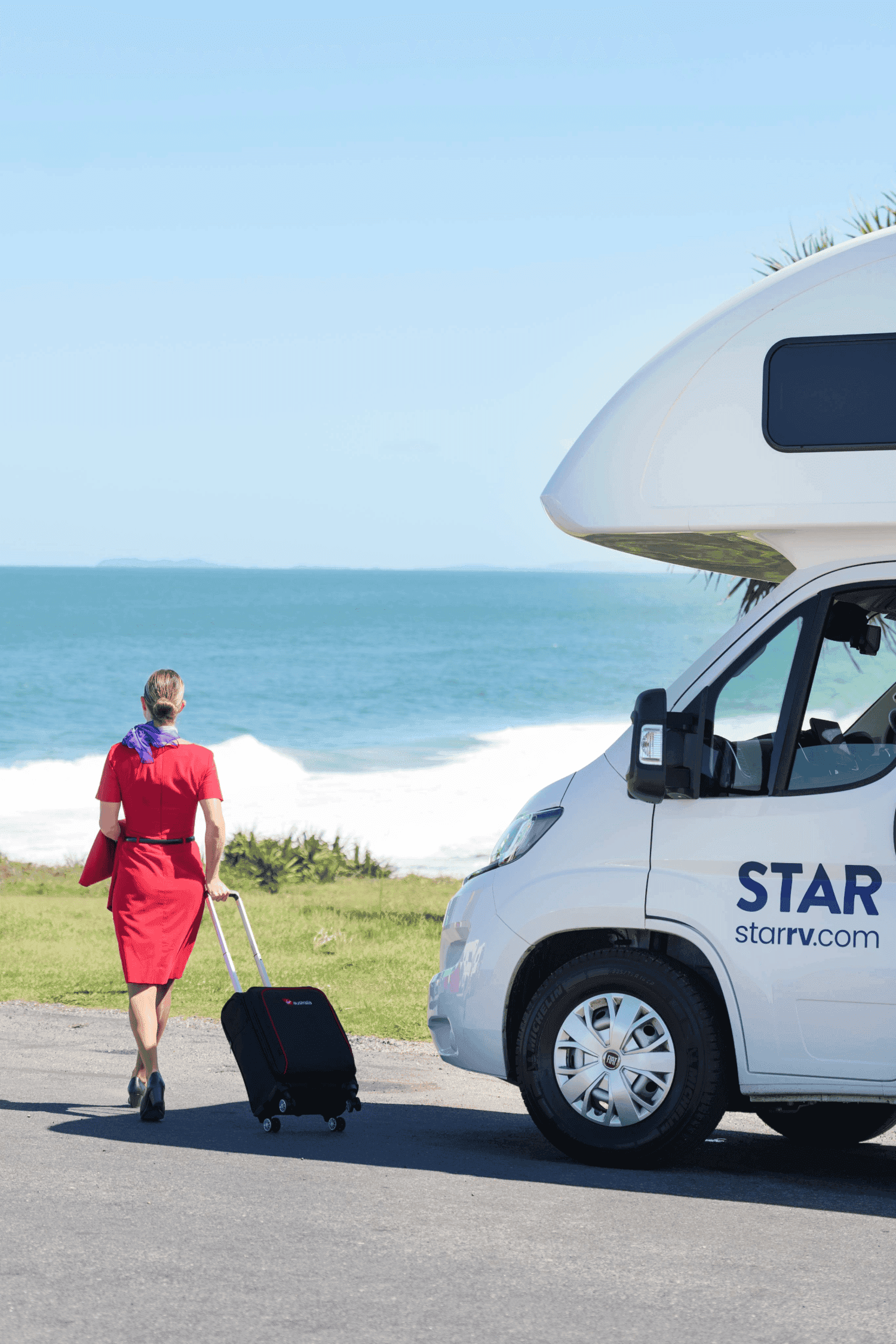 Virgin cabin crew walking past a Star RV Polaris 2 motorhome